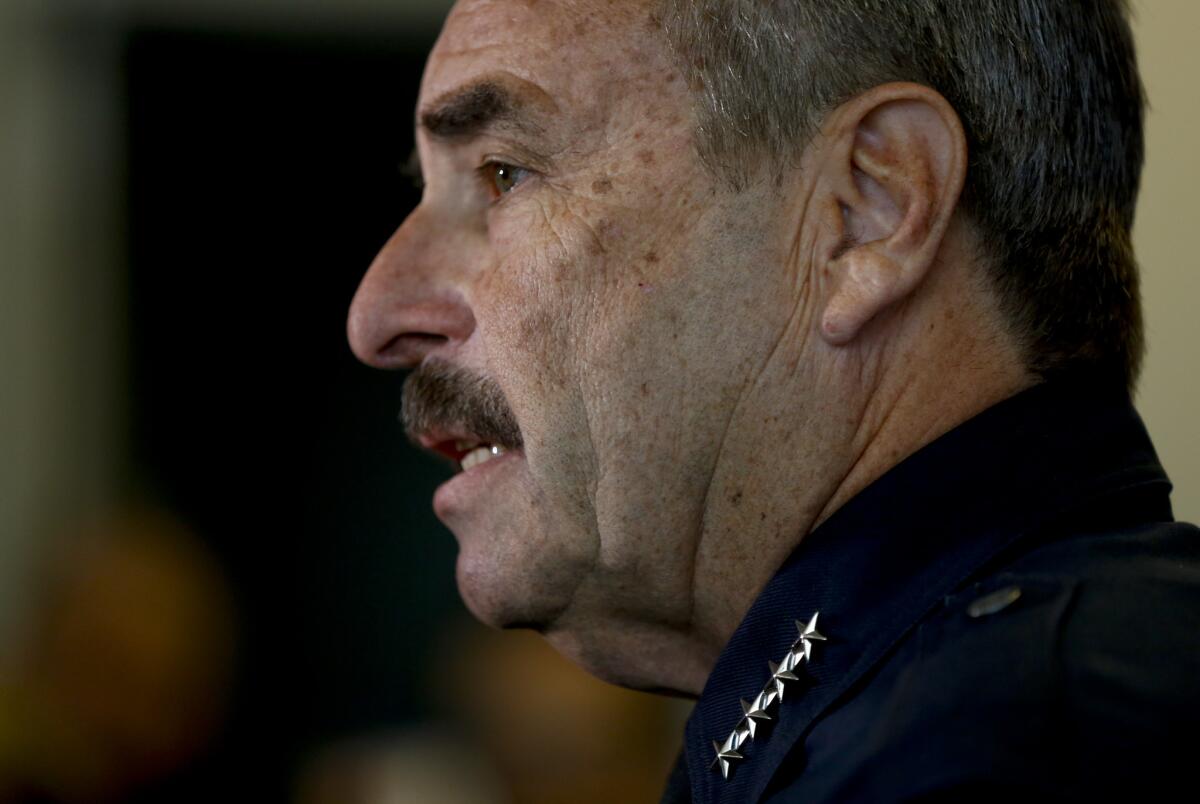 Los Angeles Police Chief Charlie Beck asked the Police Commission to delay its review of the fatal shooting of an unarmed homeless man while the district attorney's office evaluates whether to charge the officer who opened fire.