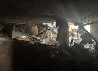 Sunlight streaming through a collapsed building