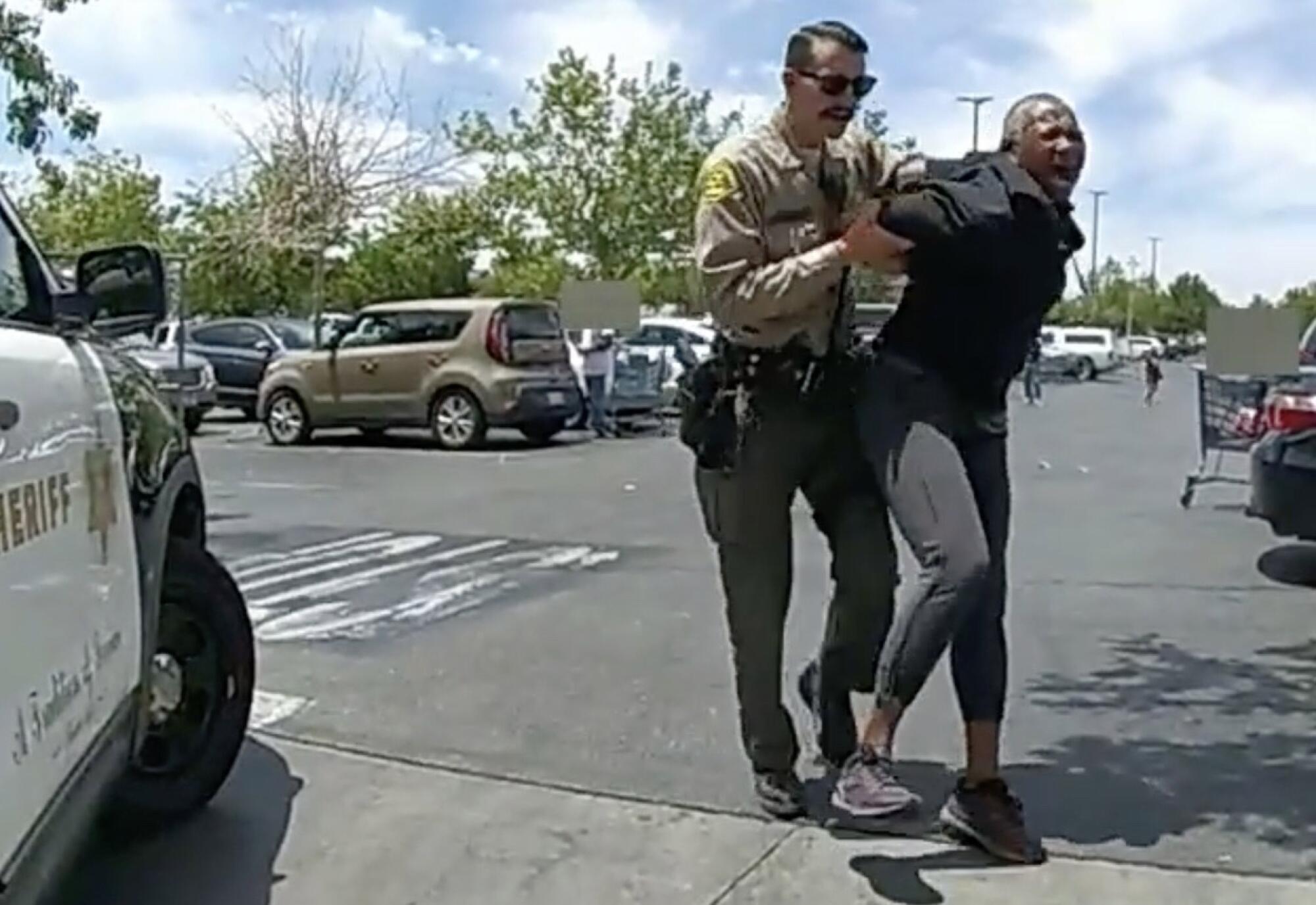 Jacy Houseton is arrested by LASD Deputy Trevor Kirk.