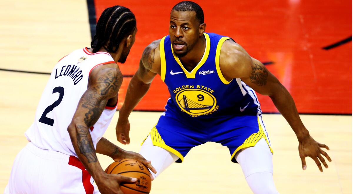 Warriors forward Andre Iguodala defends Raptors forward Kawhi Leonard (2) during Game 1 on Thursday in Toronto.