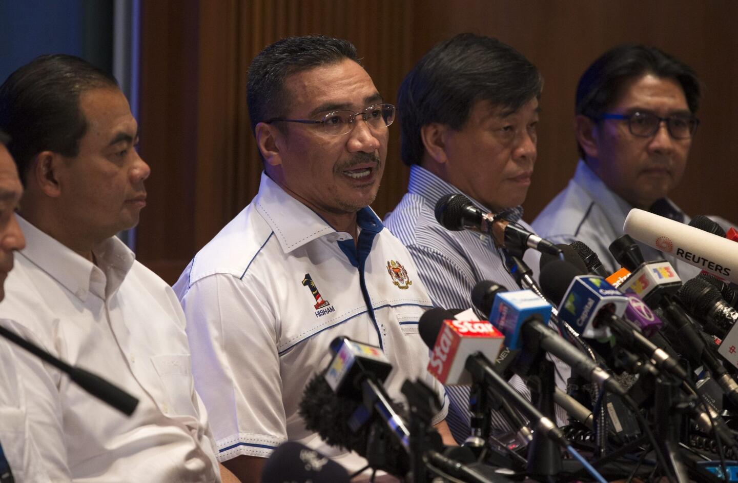 Malaysian Defence Minister and acting Transport Minister Hishammuddin Hussein (2-L) speaks during a press conference at Kuala Lumpur International Airport, Sepang, Selangor, Malaysia, on March 9.