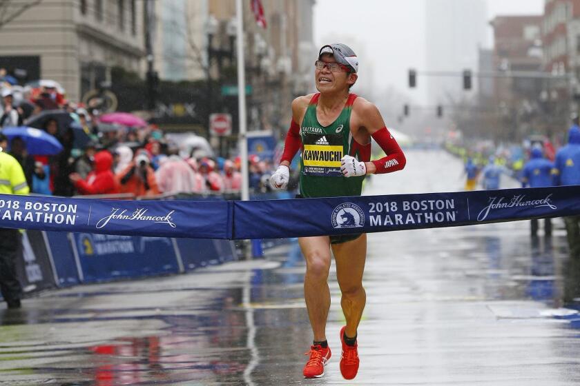 Mandatory Credit: Photo by CJ GUNTHER/EPA-EFE/REX/Shutterstock (9633964r) Yuki Kawauchi 122nd Boston Marathon, USA - 16 Apr 2018 Yuki Kawauchi of Japan crosses the finish line to win the men's division of the 122nd Boston Marathon in Boston, Massachusetts, USA 16 April 2018. The Marathon has been run annually by the Boston Athletic Association since 1897 and features more than 30,000 registerd participants. ** Usable by LA, CT and MoD ONLY **