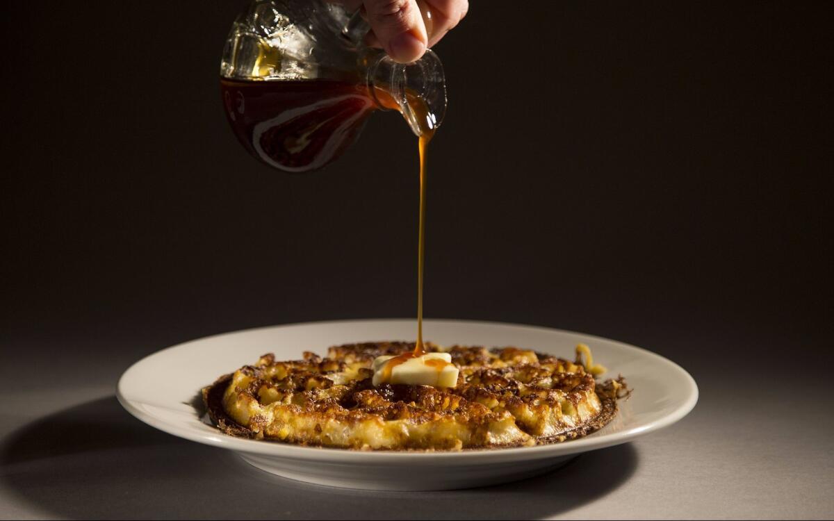 Brown sugar kitchen’s cornmeal waffles with apple cider syrup