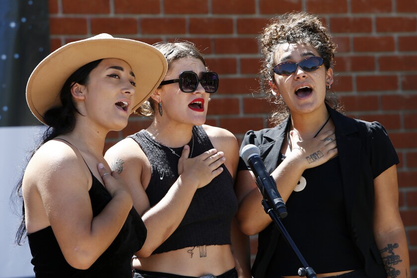 The Darden Sisters sing the national anthem at the start of the festival.