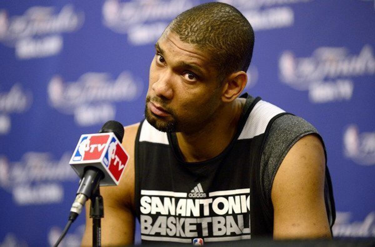 Spurs power forward Tim Duncan listens to a question during a news conference Saturday at AT&T; Center in San Antonio.