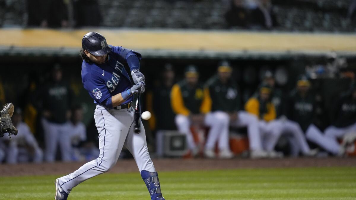 Pollock, Suárez homer late, Mariners beat A's 7-2 in 10 - The San