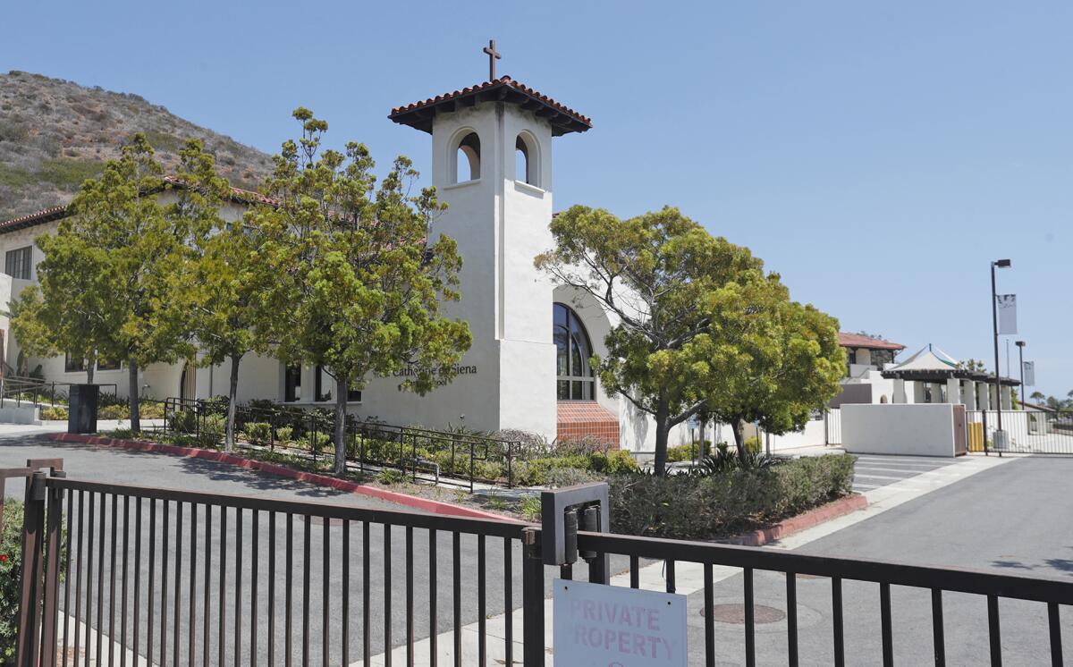 The city of Laguna Beach is considering purchasing the St. Catherine of Siena school site for $23 million.