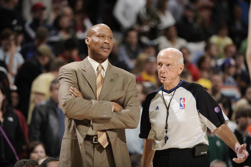 Byron Scott stands on the court as his Cleveland Cavaliers take on the Detroit Pistons in Cleveland in April 2013.