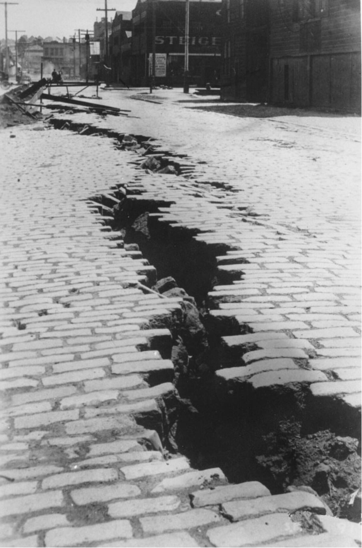 Buckled pavement and curbstones from the earthquake on April 18, 1906, in San Francisco.