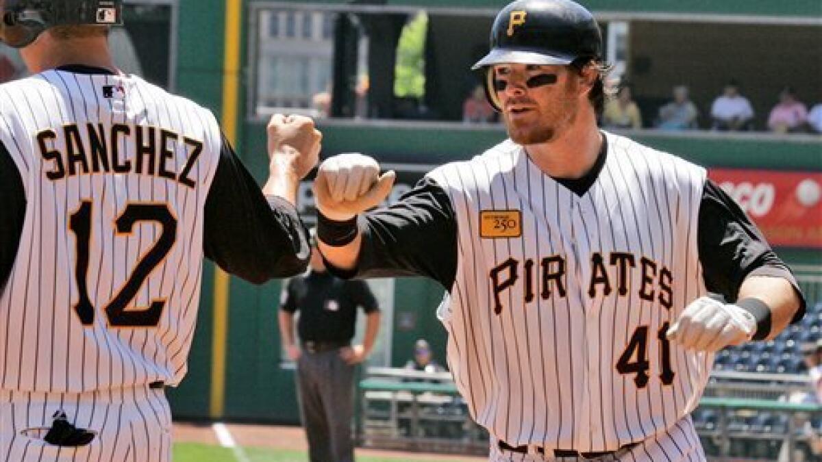 Pittsburgh Pirates' Jason Bay, right, talks with manager John