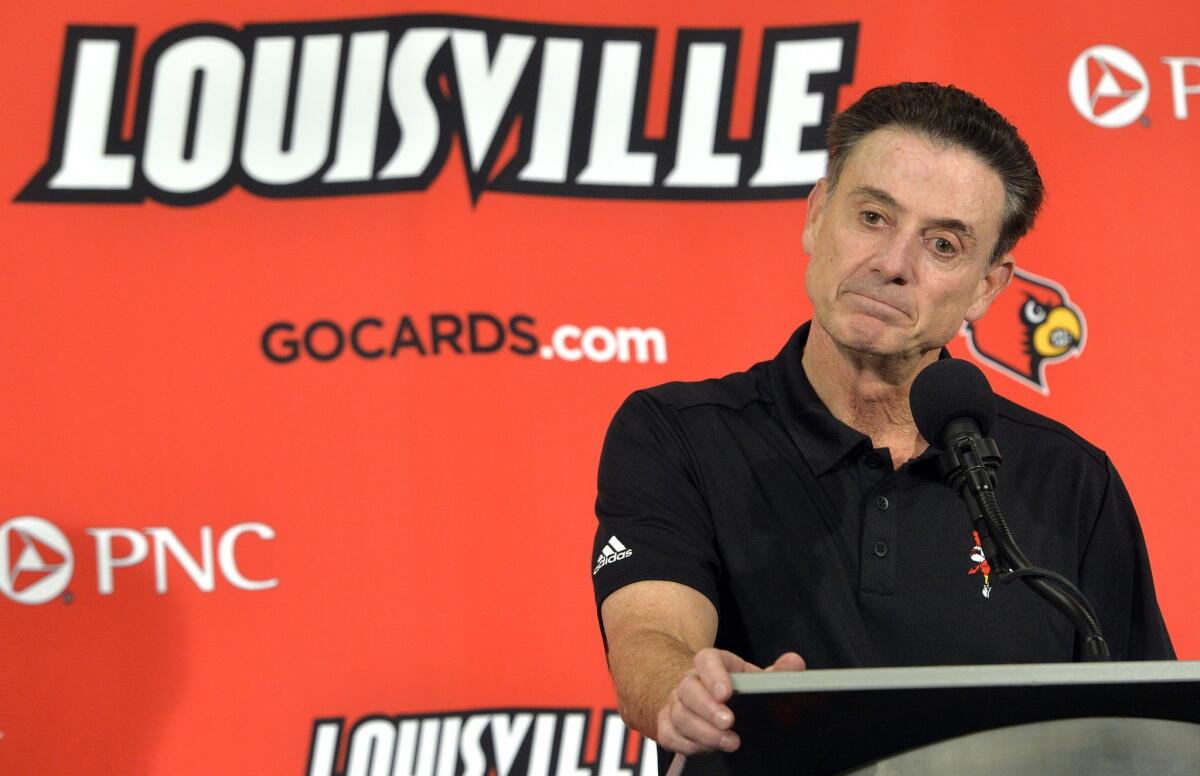 Louisville Coach Rick Pitino talks to the press on Oct. 3.