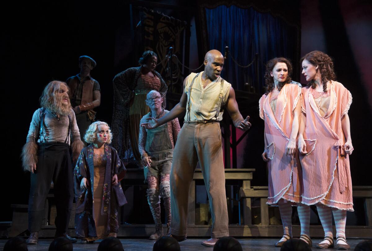 David St. Louis, center, looks toward Emily Padgett and Erin Davie, right, during "Side Show" at the St. James Theatre in New York.