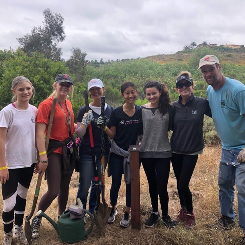 Nearly 50 volunteers, including 10 children, joined the San Dieguito River Valley Conservancy to repair trails and water plants at Gonzales Canyon Open Space Preserve as part of National Trails Day. Volunteers, some of whom are pictured, repaired the Sword Way Trailhead and main multiuse trail, watered more than 200 native plantings and installed plant identification signs in the demonstration garden. They also repaired the erosion around the Sword Way footbridge and cleared trails of overhanging brush to make a safe passage for hikers, mountain bikers and horseback riders. Project partners included San Diego Mountain Biking Association and San Diego Canyonlands with support from San Diego Department of Parks and Open Space, Black Mountain District and a local group of National Charity League volunteers. The sponsor was REI Outdoors. Photo courtesy of San Diego Canyonlands