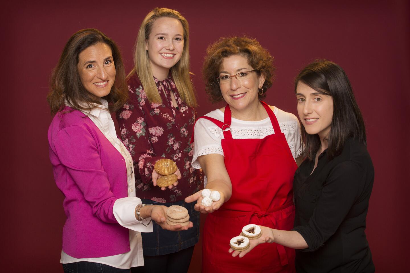 Four of the top five contestants from the 6th Los Angeles Times Holiday Cookie Bake-Off. Lt to Rt: Deborah Pappalau, Fiona Marshall, Beth Corman Lee and Jessica Levy holding their cookies.
