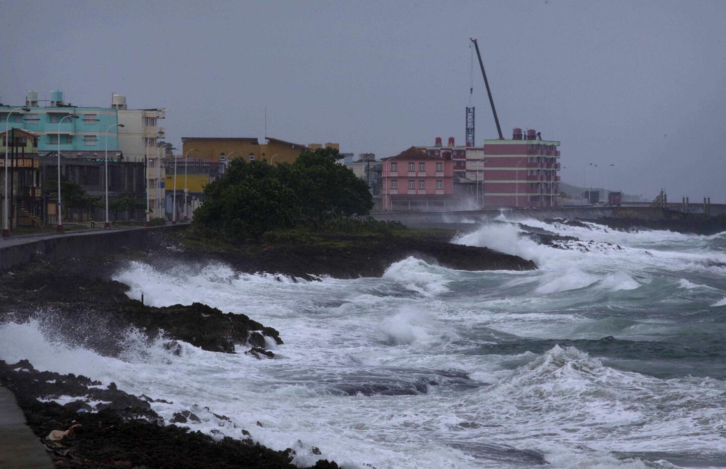 Waves crash against a seawall in Baracoa, Cuba, on Oct. 4, 2016, before the arrival of Hurricane Matthew.