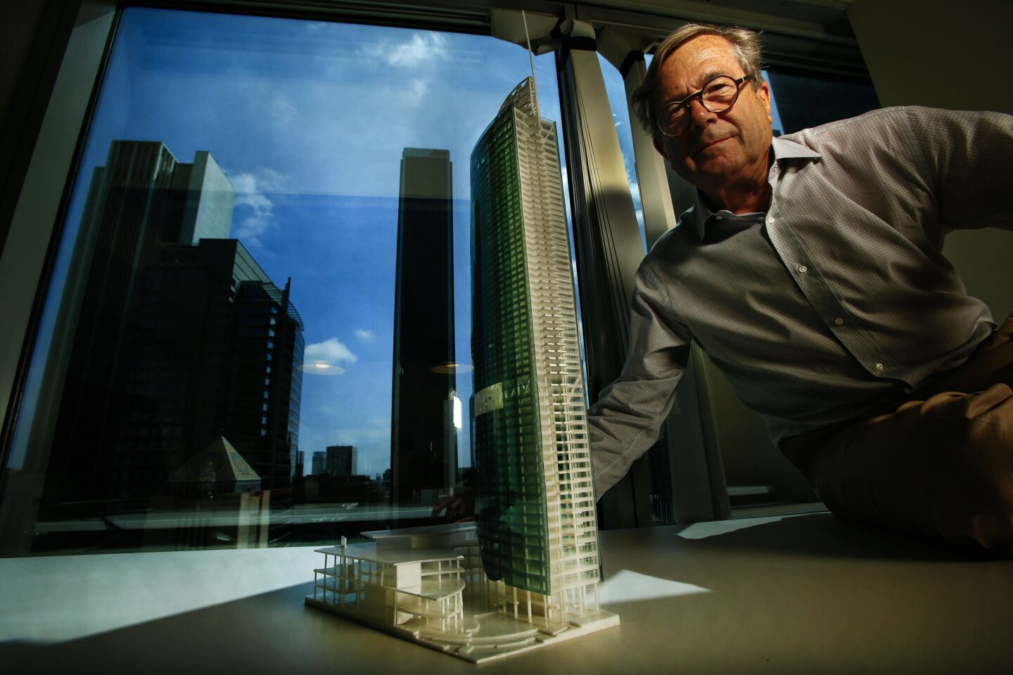 David Martin of A.C. Martin Partners, the firm responsible for the design of the Wilshire Grand tower, shows a model of the 73-story skyscraper.