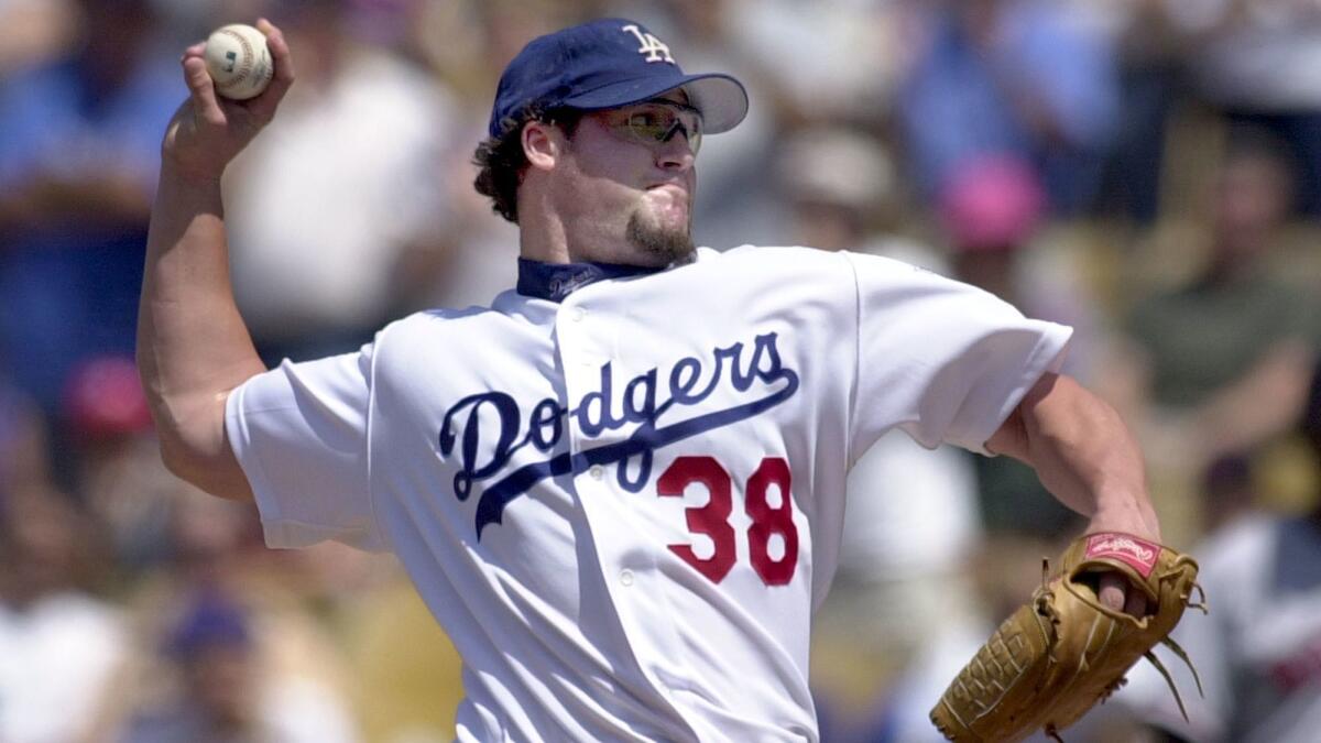 Pitcher Eric Gagne of the Los Angeles Dodgers can only watch from