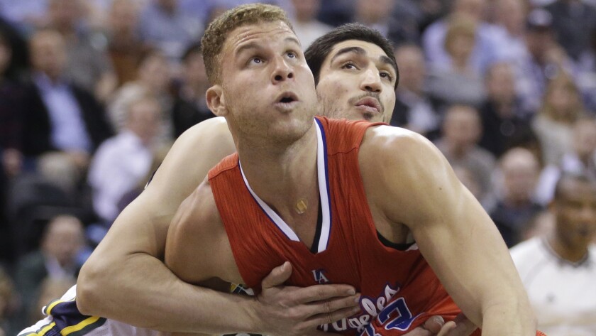 Utah Jazz center Enes Kanter and Clippers forward Blake Griffin, front, battle for position under the basket during a game on Jan. 28.