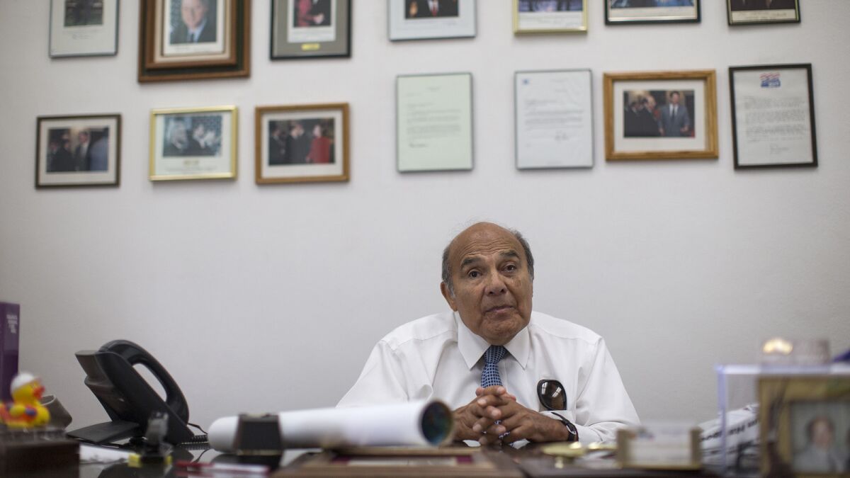 South Gate Mayor Henry Gonzalez sits in his office at City Hall. His negotiating skills for the United Auto Workers International Union earned him the nickname "Hammerin' Hank."