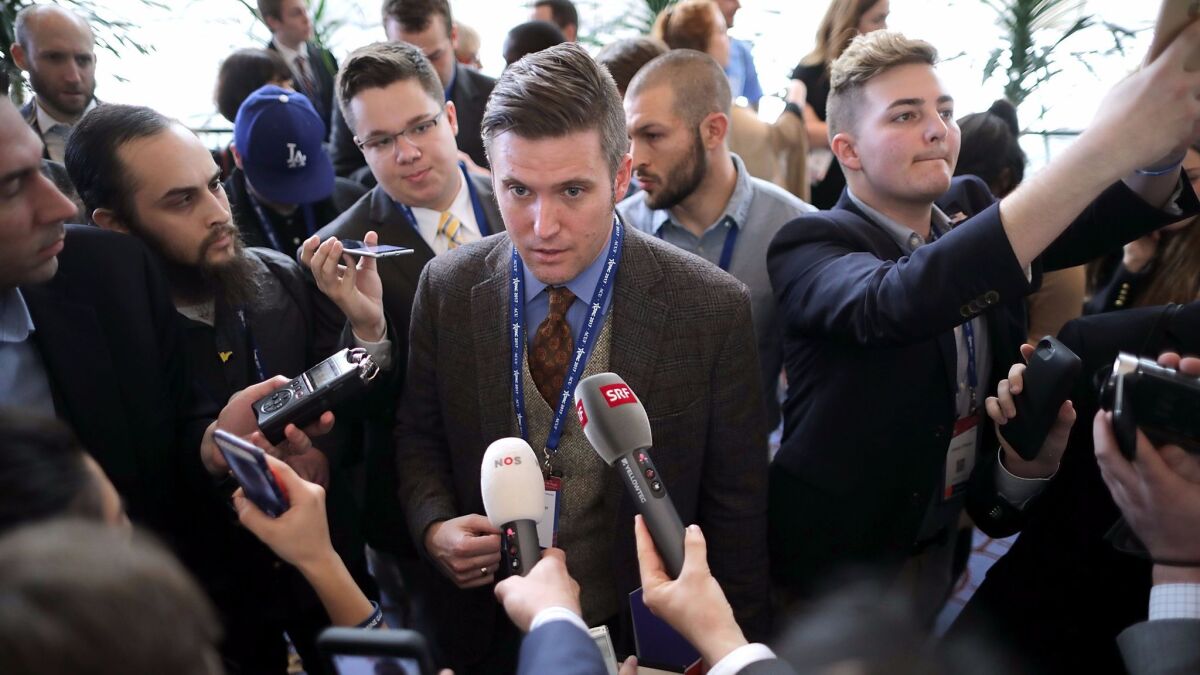 Reporters surround white nationalist Richard Spencer at the Conservative Political Action Conference.