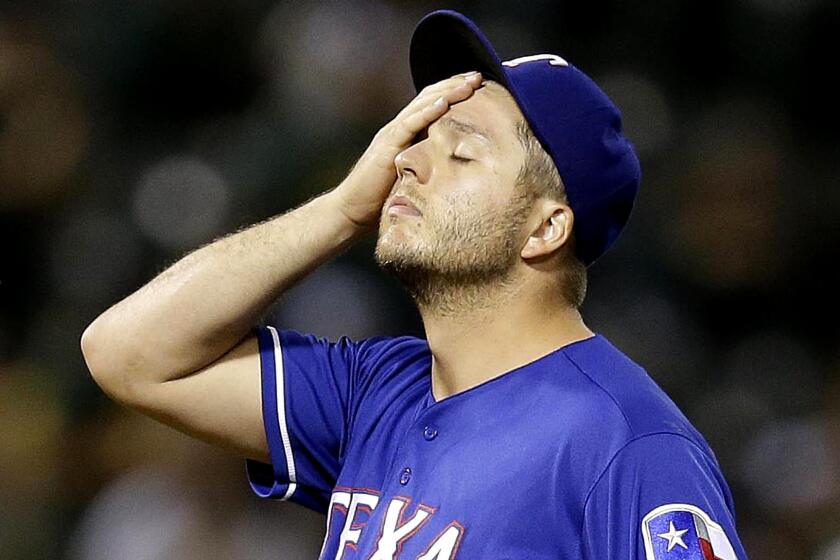 Rangers relief pitcher Shawn Tolleson blew his fourth save of the season when giving up a grand slam to Oakland's Khris Davis with two out in the ninth inning Tuesday night.