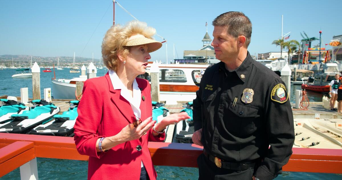 Assemblywoman Diane Dixon (R-Newport Beach) speaks with Newport Beach Fire Department Chief Jeff Boyles.
