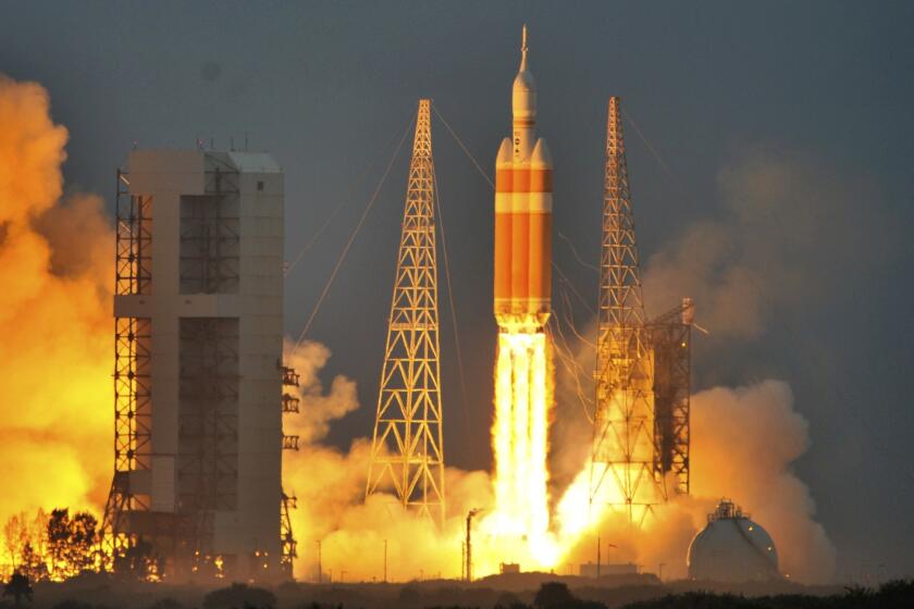 The Delta IV Heavy rocket with the Orion space capsule lifts off from the Cape Canaveral Air Force Station in Cape Canaveral, Florida on December 5, 2014.