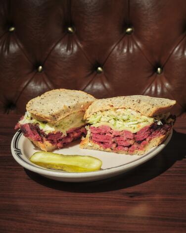 The #19 pastrami sandwich at Langer's Deli, in side-by-side halves with a pickle spear 