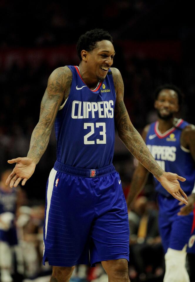 Lou Williams laughs as he walks down the court during the Clippers' 118-106 victory over the Timberwolves on Feb. 1 at Staples Center.
