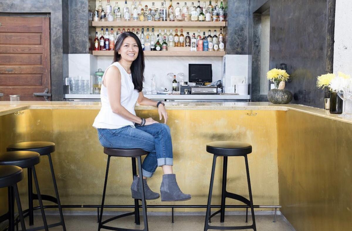 Dina Samson sits at her restaurant counter