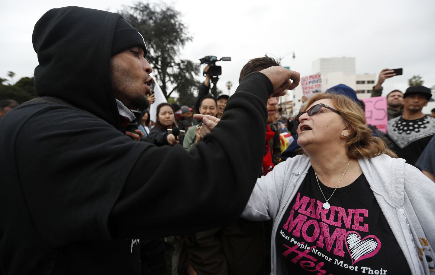 Pro and anti-Trump denonstrators get into a verbal confrontation at Beverly Gardens Park in Beverly Hills on Tuesday, Mar. 13, 2018.