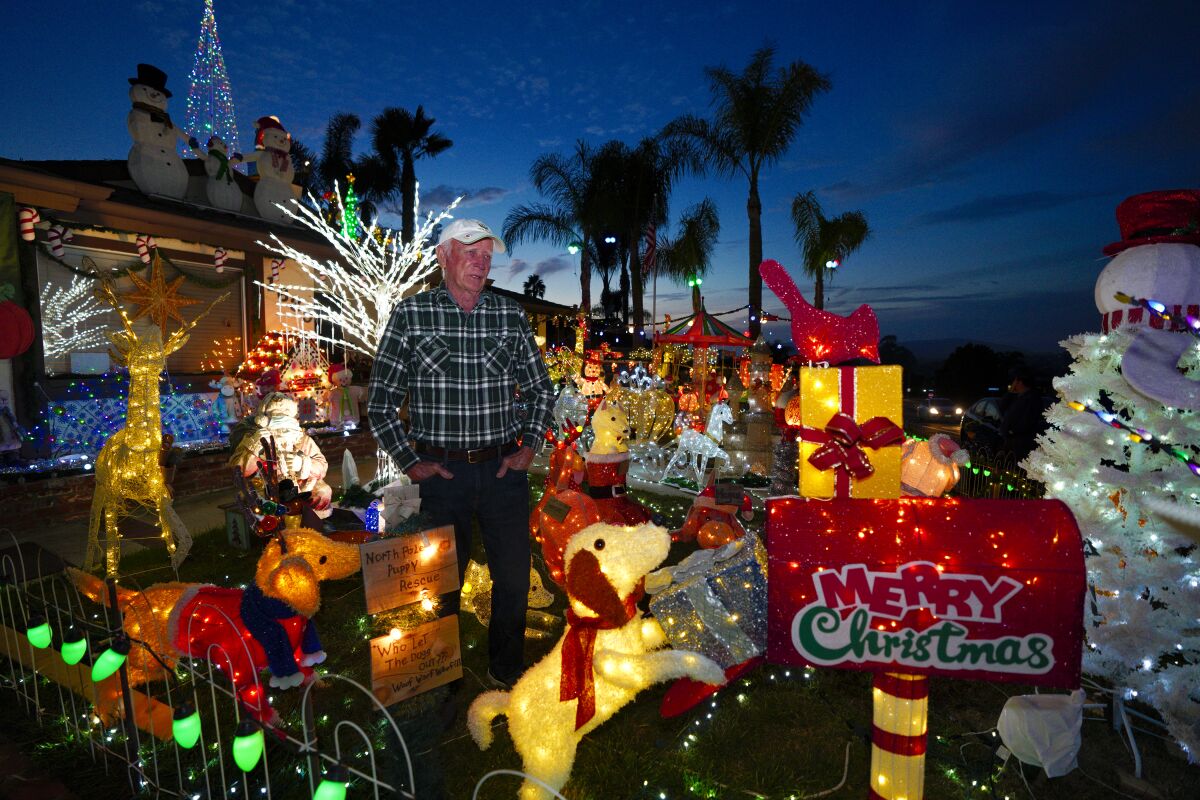 Bill Gillfillen, 83, tests out the lights on his "Christmas on Knob Hill" light display in San Marcos 