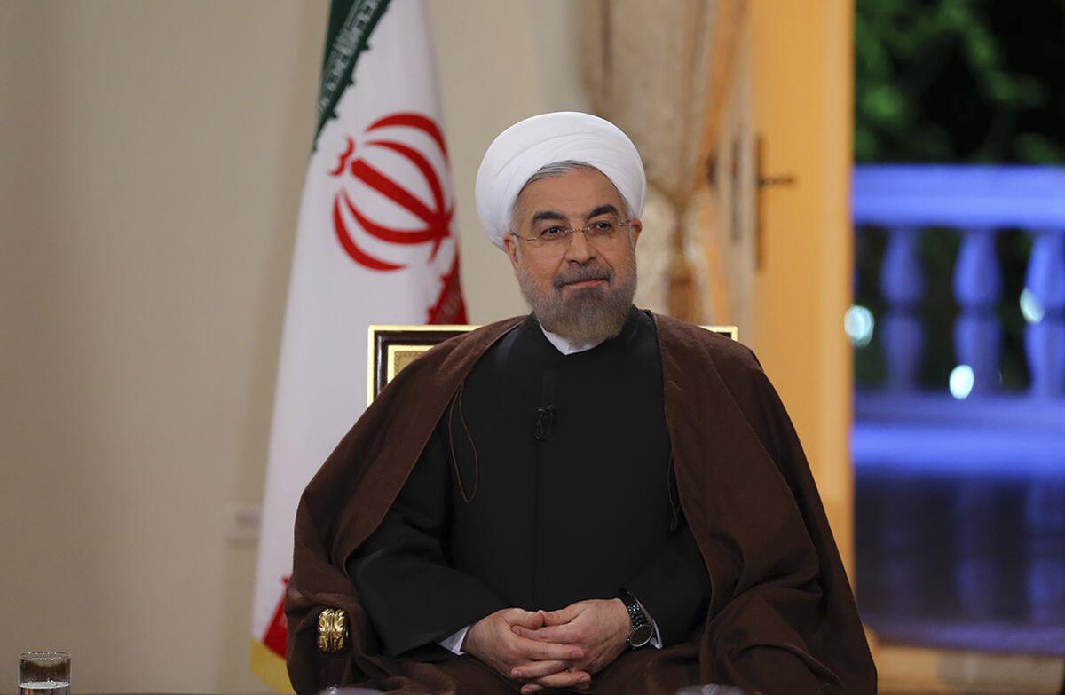 Iranian President Hassan Rouhani, shown on state-run TV in Tehran on Oct. 13, has reportedly directed Iran's oil ministry to seek a meeting of the Organization of Petroleum Exporting Countries cartel next month to discuss propping up oil prices.