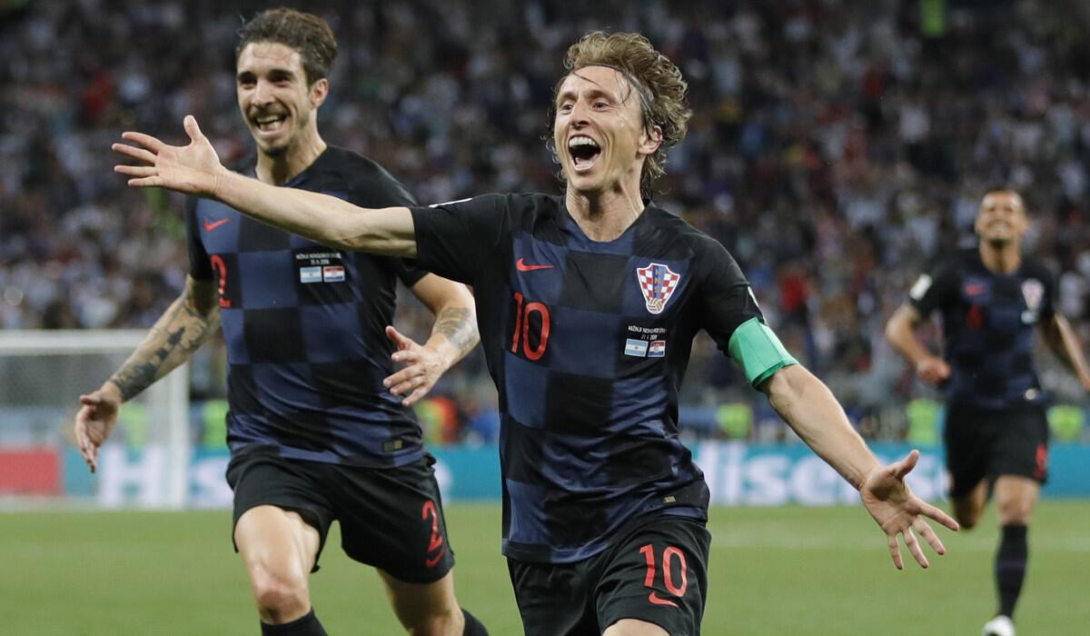 Croatia's Luka Modric, center, celebrates with teammates after scoring a goal during the Group D match against Argentina at the World Cup.