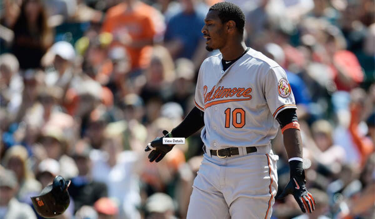 Baltimore's Adam Jones tosses his helmet away after striking out for the final out of the sixth inning against the San Francisco Giants on Sunday.