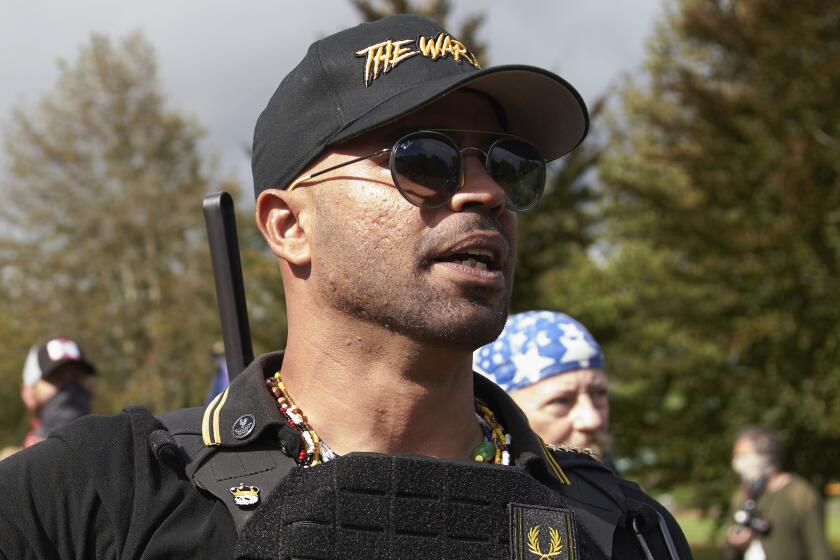 FILE - Proud Boys leader Enrique Tarrio speaks at a rally in Delta Park on Sept. 26, 2020, in Portland, Ore. Tarrio is set to be sentenced on Wednesday, Aug. 30, 2023, for a failed plot to keep Donald Trump in power after the Republican lost the 2020 presidential election, capping one of the most significant prosecutions in the Jan. 6, 2021, attack on the U.S. Capitol. (AP Photo/Allison Dinner, File)