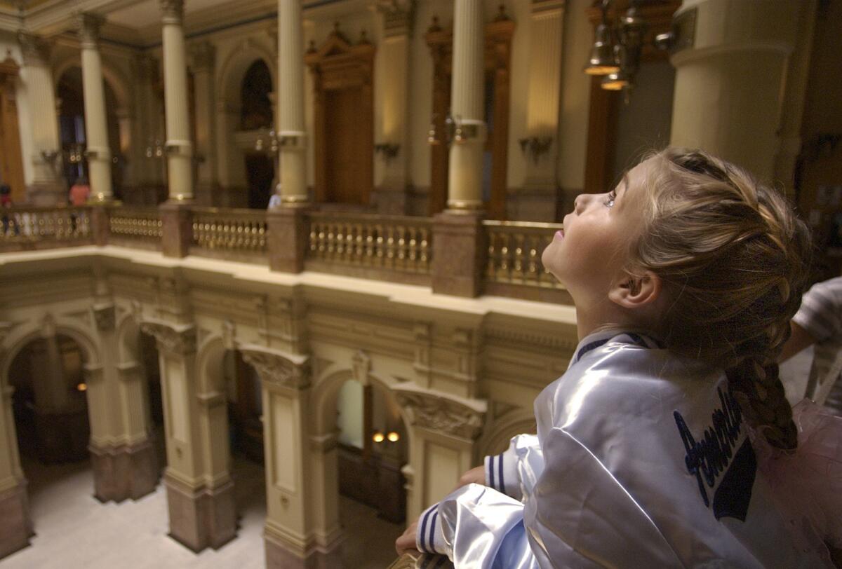 Lily Thorpe of Grand Junction, Colo., visits the state Capitol in Denver. Colorado could become the first state to have its Legislature led by two Latinas.