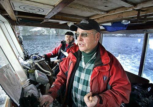 Ferrying visitors to the 36-acre Rabbit Island from their home on Lasqueti Island, brothers Gordon, right, and Bruce Jones are Rabbit Islands security team, Auxiliary Canadian Coast Guard members and restockers of toilet paper in nearby Jedidiah Islands public restrooms  their most lucrative gig.