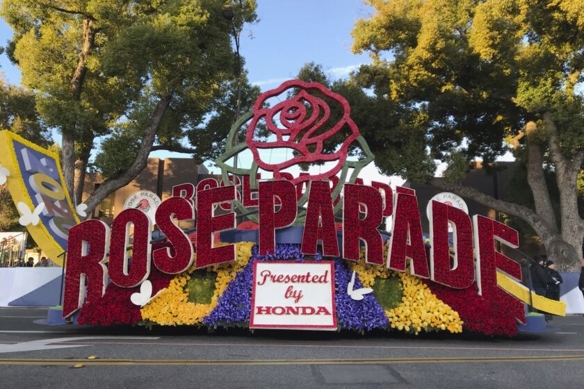 FILE - In this Jan. 1, 2020, file photo a 2020 Rose Parade float is seen at the start of the route at the 131st Rose Parade in Pasadena, Calif. The 2021 Rose Parade is canceled because of the coronavirus pandemic, but viewers will still get a show with a two-hour television special on New Year's Day, organizers said. The Tournament of Roses Association said in a Thursday, Oct. 29, 2020, news release that the TV special will include "live-to-tape musical and marching band performances, heartwarming segments related to the Rose Parade, celebrity guest appearances," and highlights from past Rose Bowl football games. (AP Photo/Michael Owen Baker, File)
