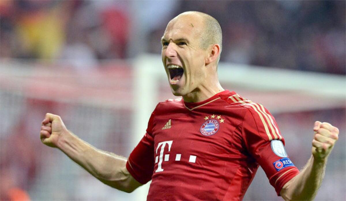 Munich's Arjen Robben celebrates after scoring the 3-0 lead during the UEFA Champions League semi final first leg soccer match between FC Bayern Munich and FC Barcelona in Munich, Germany.