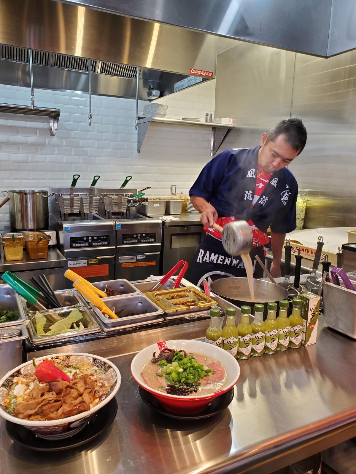 Chef Satoshi Ikuta prepares dishes at the La Jolla location of Ramen Nagi.