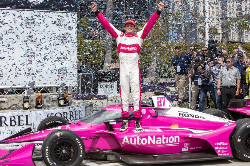 LONG BEACH, CA - APRIL 16: Kyle Kirkwood celebrates in Victory Circle after winning the 48th annual Grand Prix of Long Beach.