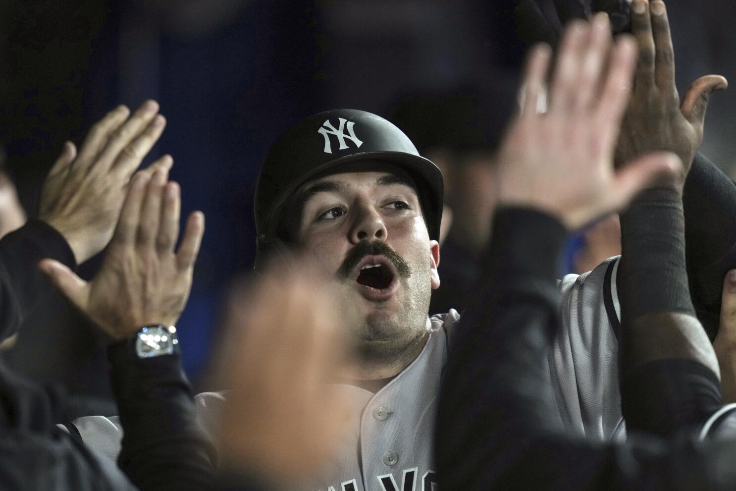 Blue Jays fan gives home-run ball to young Yankees fan 