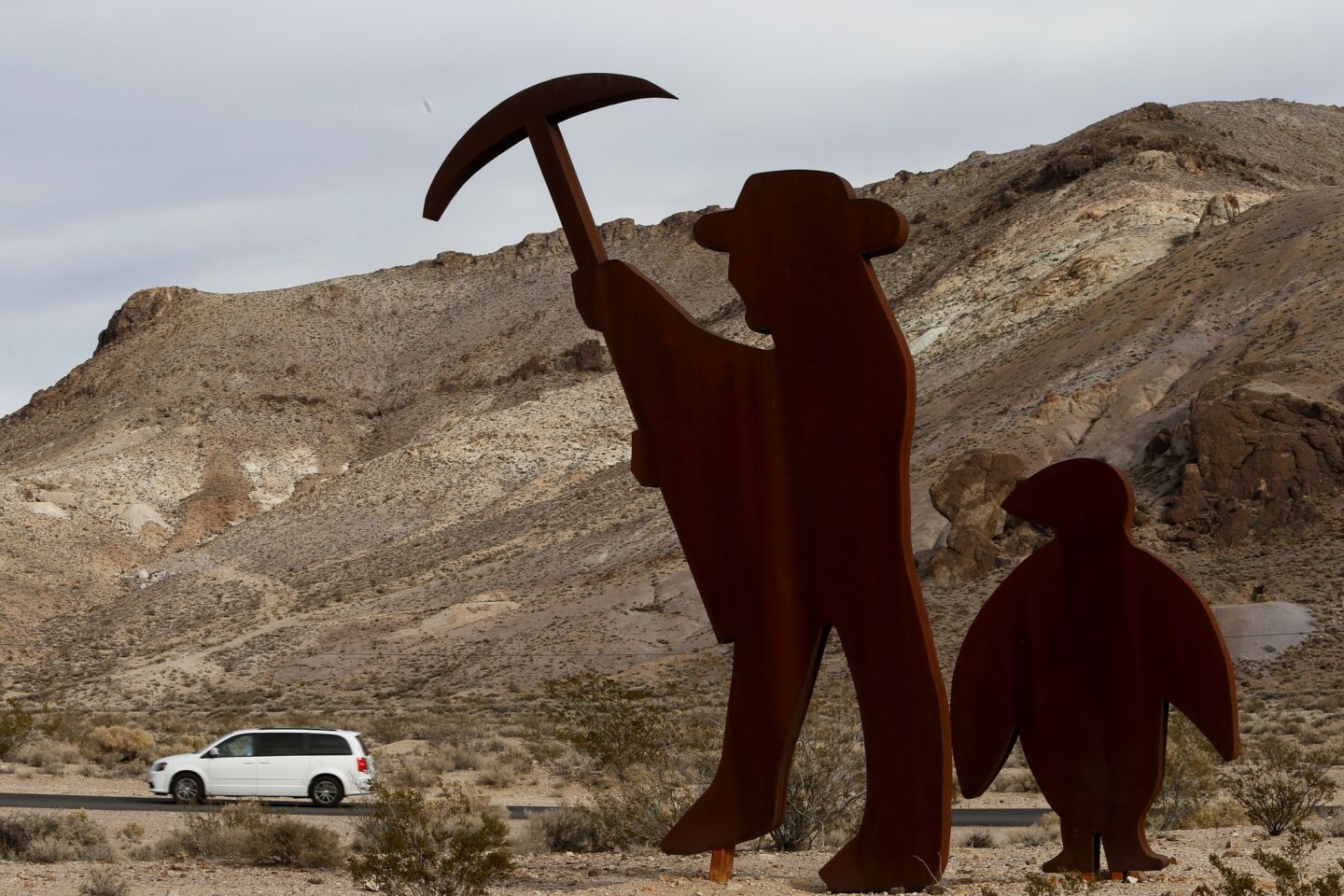 Rhyolite, Nev., a ghost town a short drive away from Death Valley National Park, greets visitors with a giant metal statue of a miner.