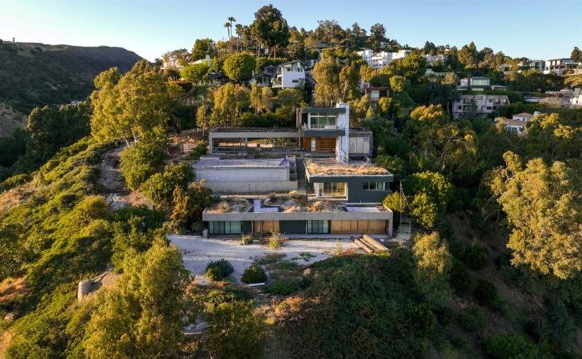 The four-story home was marketed as either a tear-down or renovation project.