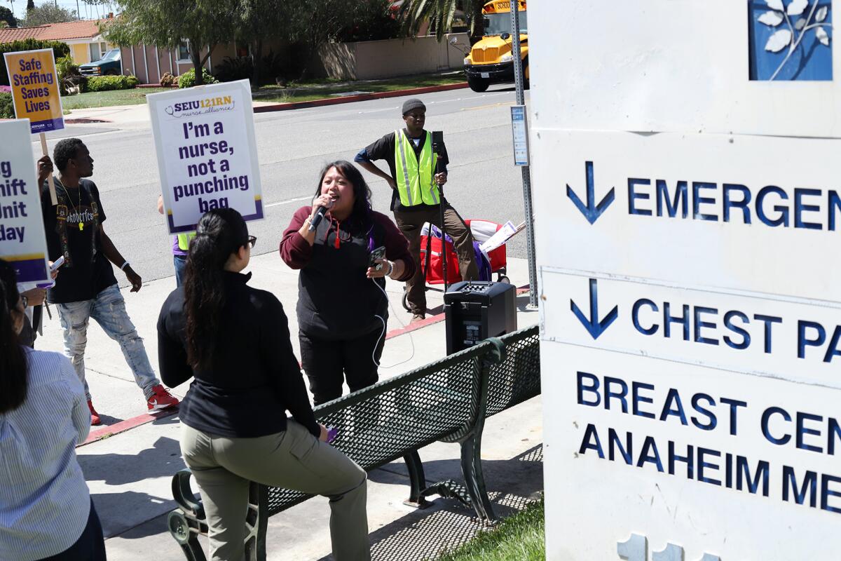 A nurse spoke during a picket outside Anaheim Regional Medical Center.