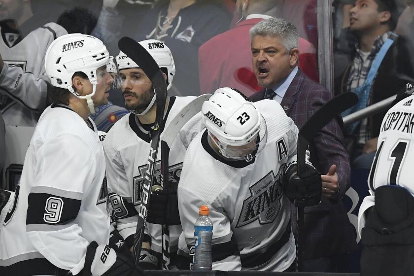 Los Angeles Kings head coach Todd McLellan talks to his team during overtime of an NHL hockey game against the Colorado Avalanche Saturday, Feb. 22, 2020, in Los Angeles. The Avalanche won 2-1 in overtime. (AP Photo/Mark J. Terrill)