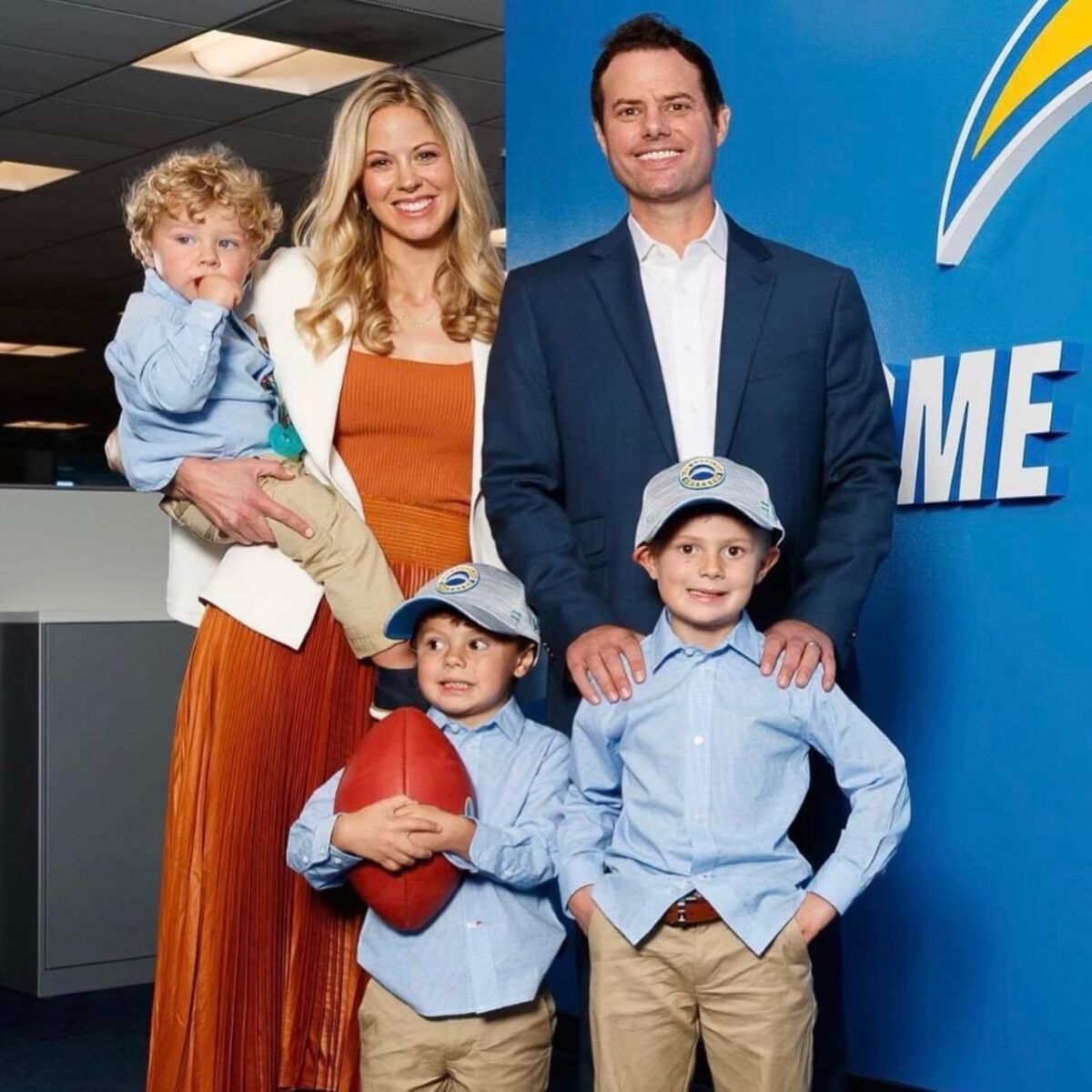 New Chargers coach Brandon Staley stands with his wife, Amy, and sons Colin, Will and Grant.