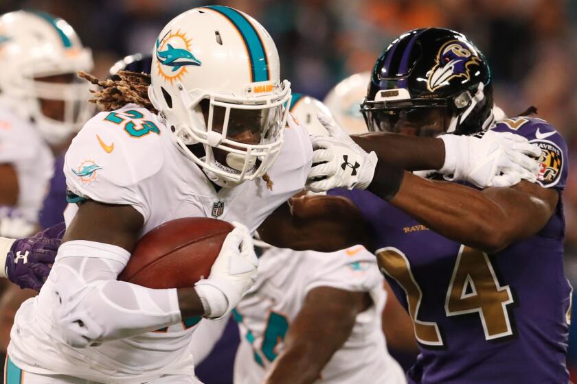 BALTIMORE, MD - OCTOBER 26: Running Back Jay Ajayi #23 of the Miami Dolphins carries the ball in the first quarter against the Baltimore Ravens at M&T Bank Stadium on October 26, 2017 in Baltimore, Maryland. (Photo by Todd Olszewski/Getty Images) ** OUTS - ELSENT, FPG, CM - OUTS * NM, PH, VA if sourced by CT, LA or MoD **