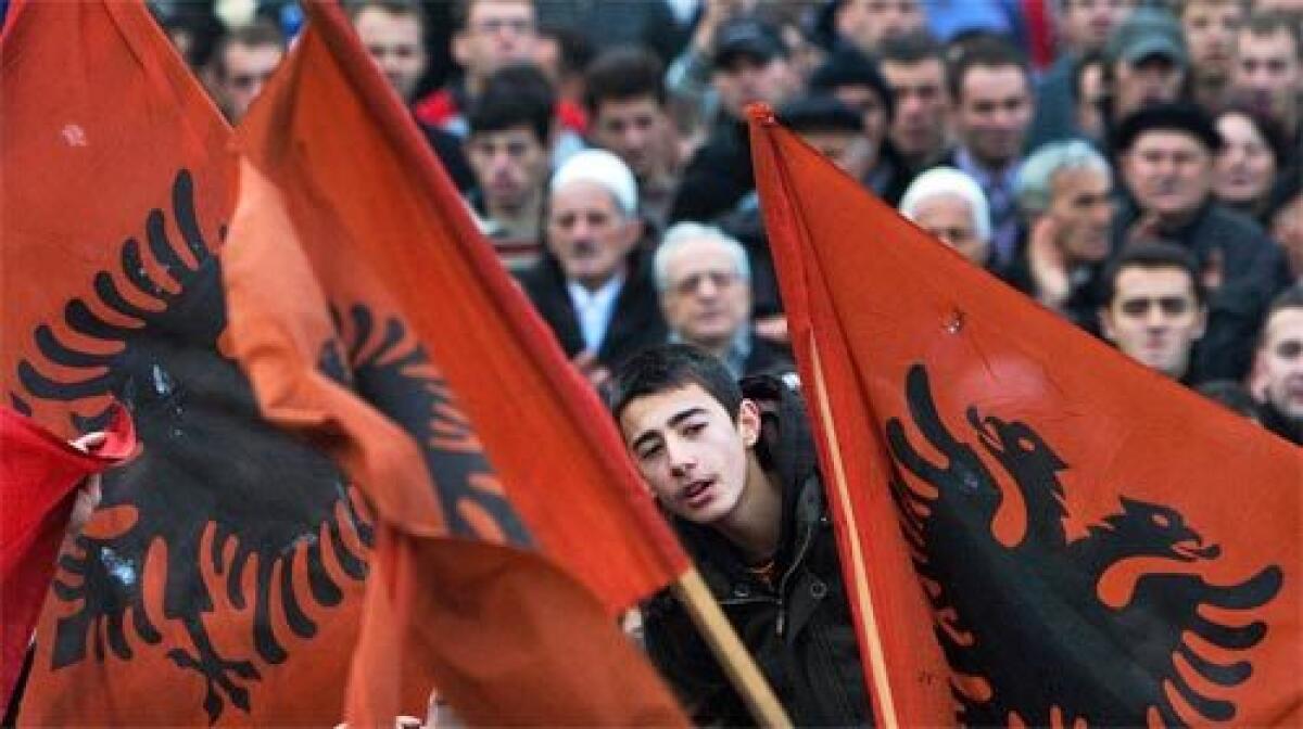 INDEPENDENCE CRY: Kosovo Albanians rally in Pristina, the provincial capital, to press their leaders to follow through with promises of independence from Serbia.